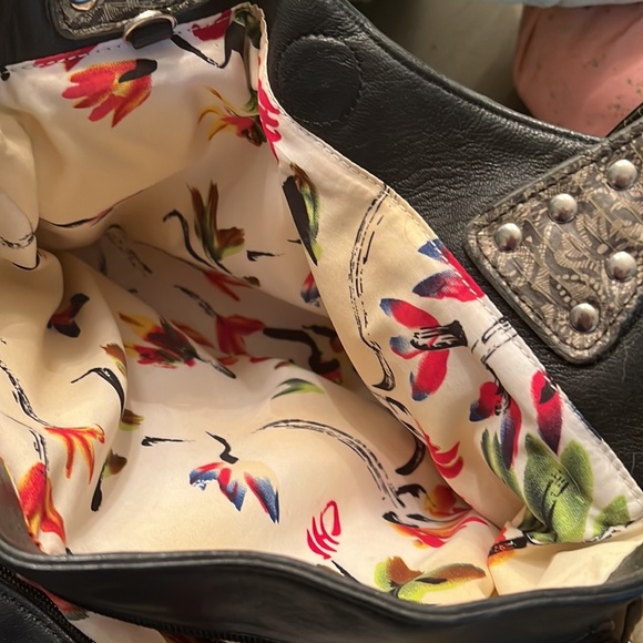 Black butter soft leather purse with grey snake handles and front pockets. - Picture 4 of 7